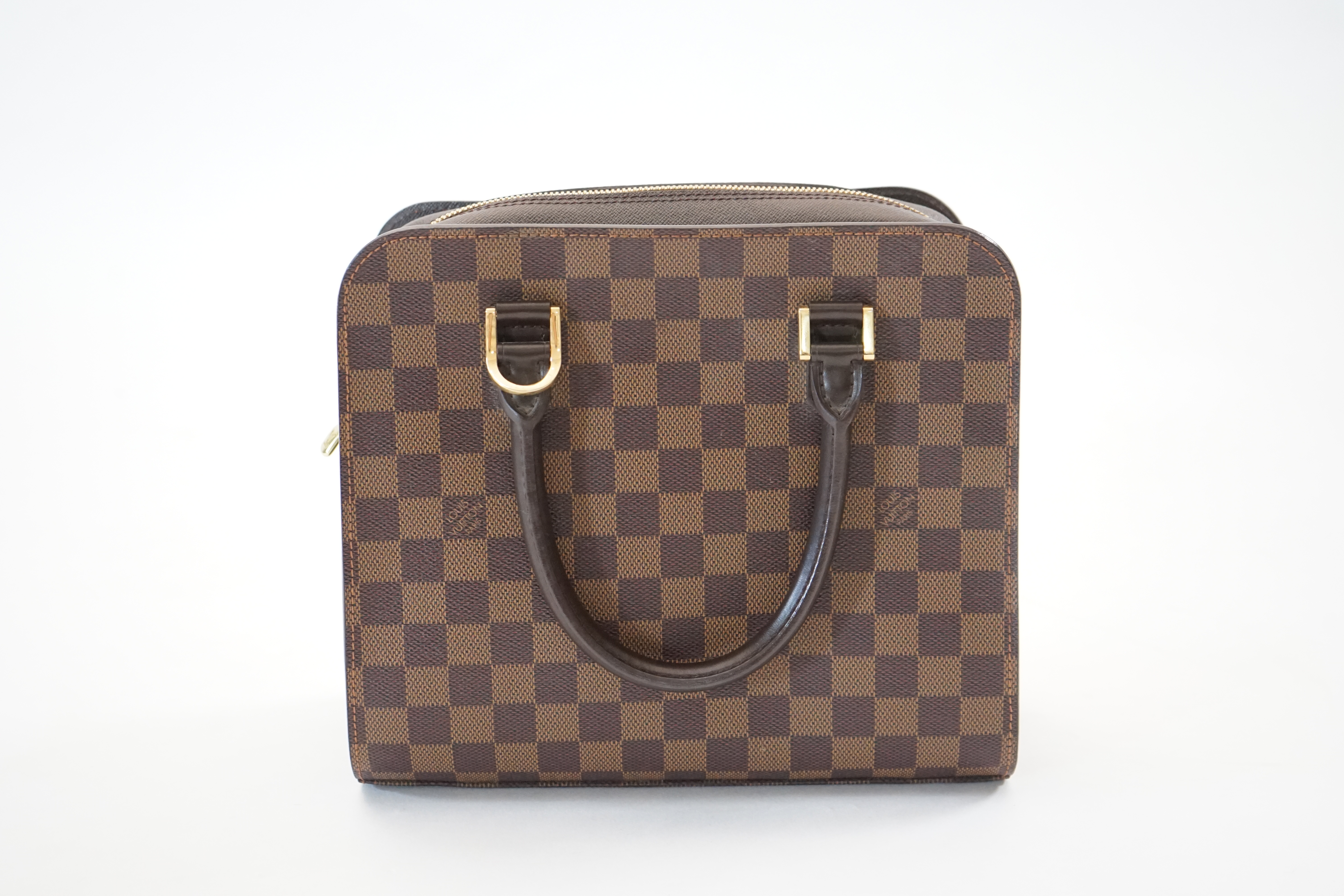 A Louis Vuitton Triana handbag, styled in Damier canvas width 26cm, depth 12cm, height 22cm handle 11cm